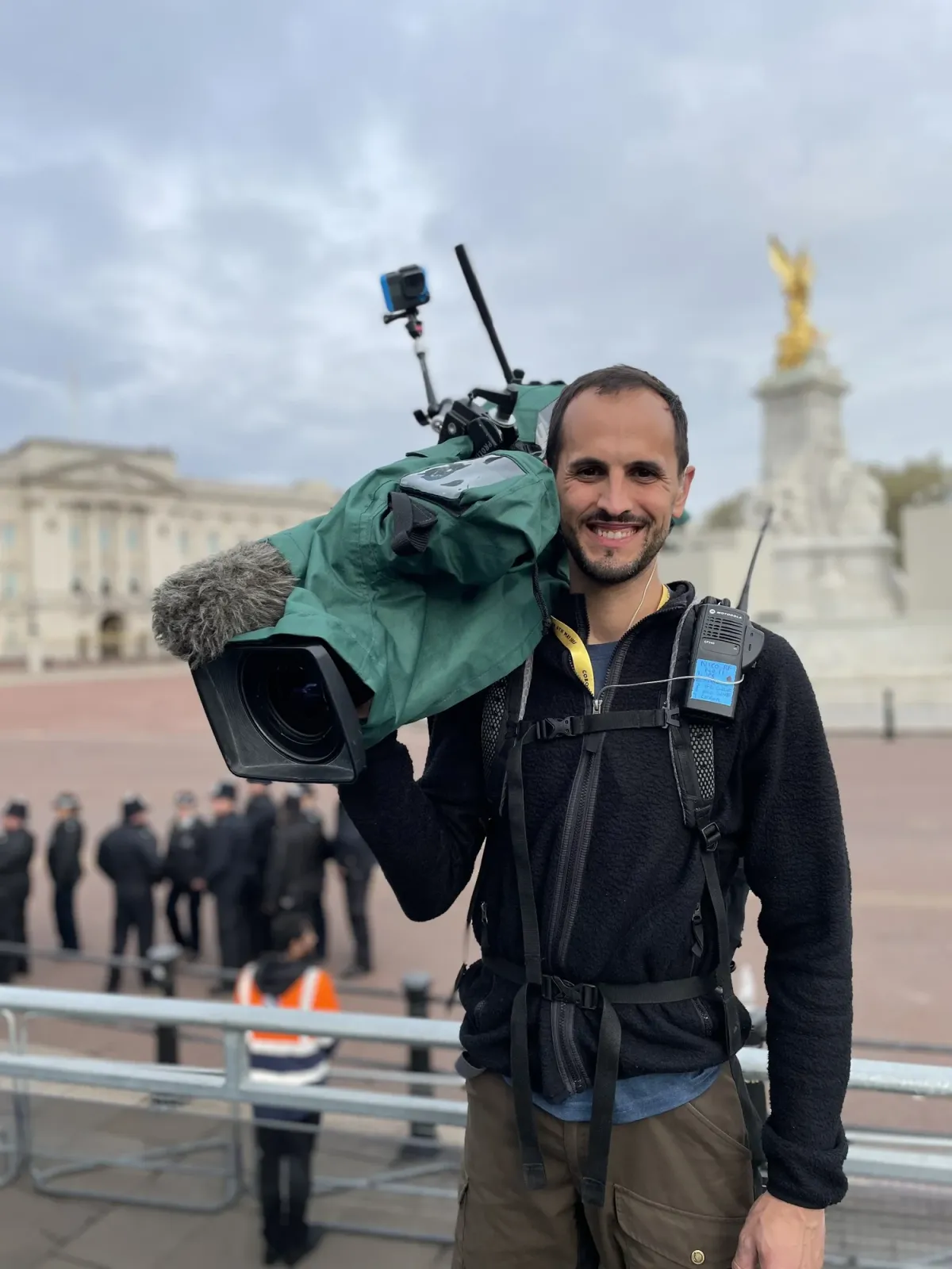 Nico Hambleton filming outside Buckingham Palace at the King's Coronation